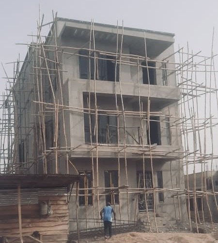 Multi-storey building under construction with external scaffolding
